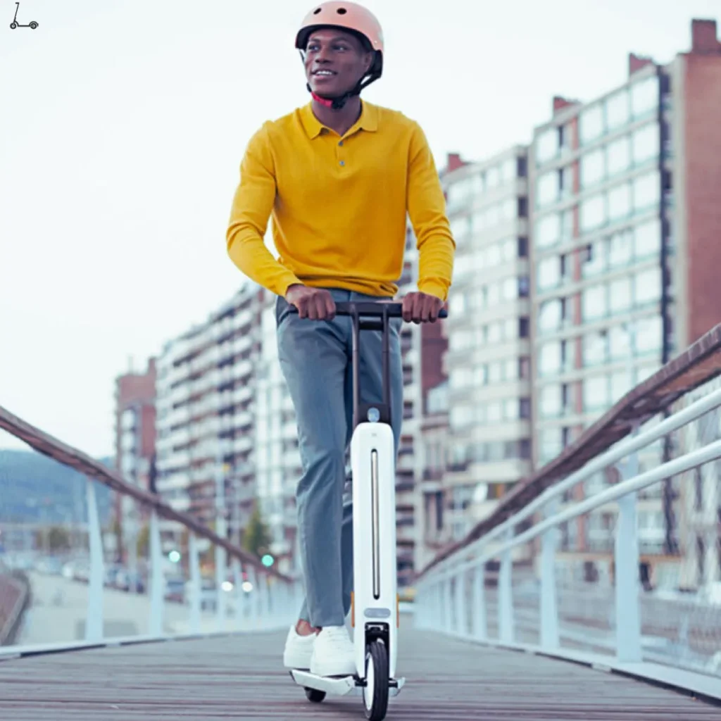 Man riding segway ninebot on the bridge