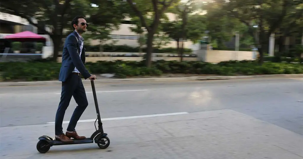 Man riding ninebot scooter in sports mode